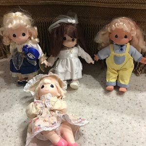 Selling 4 precious moments dolls together